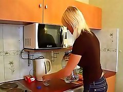 Blond chick is doing her businesses in the kitchen previous to getting holes nailed